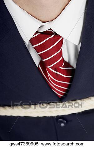 Close-up of a businessman tied up with rope View Large Photo Image Stock Photography - Close-up of a businessman tied up with rope. Fotosearch