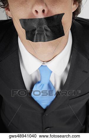 Close-up of a businessman with duct tape on his mouth View Large Photo Image Stock Image - Close-up of a businessman with duct tape on his mouth. Fotosearch