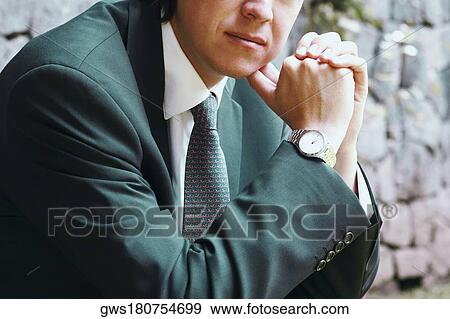 Close-up of a businessman with his hands clasped View Large Photo Image Stock Photo - Close-up of a businessman with his hands clasped. Fotosearch