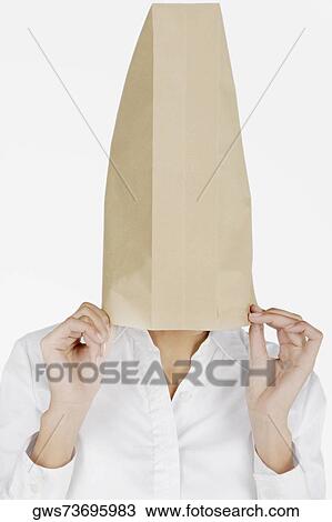 Close-up of a businesswoman covering her face with a paper bag View Large Photo Image Stock Image - Close-up of a businesswoman covering her face with a paper bag. Fotosearch