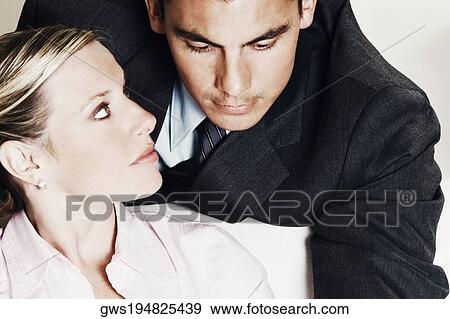 Close-up of a businesswoman looking at a businessman View Large Photo Image Stock Photo - Close-up of a businesswoman looking at a businessman. Fotosearch