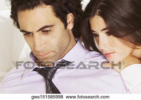 Close-up of a businesswoman resting her head on a businessman's shoulder View Large Photo Image Stock Photo - Close-up of a businesswoman resting her head on a businessman's shoulder. Fotosearch