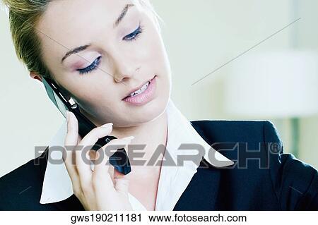Close-up of a businesswoman talking on a mobile phone View Large Photo Image Stock Image - Close-up of a businesswoman talking on a mobile phone. Fotosearch