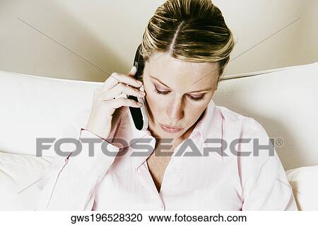 Close-up of a businesswoman talking on a mobile phone View Large Photo Image Stock Image - Close-up of a businesswoman talking on a mobile phone. Fotosearch