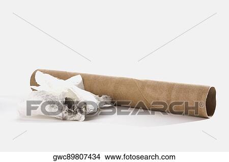 Picture - Close-up of a cardboard tube with a piece of cloth. Fotosearch
