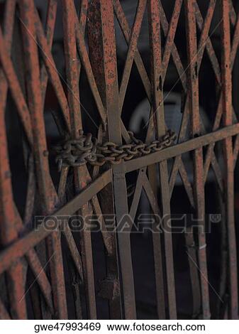 Close-up of a chain on a gate View Large Photo Image Stock Photo - Close-up of a chain on a gate. Fotosearch