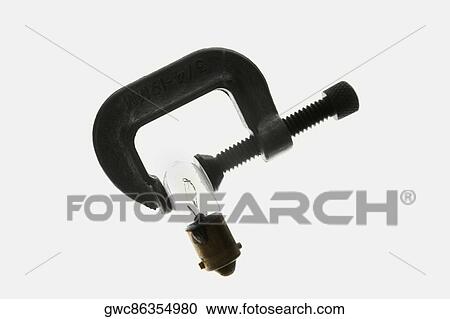 Close-up of a clamp holding a light bulb View Large Photo Image Stock Image - Close-up of a clamp holding a light bulb. Fotosearch