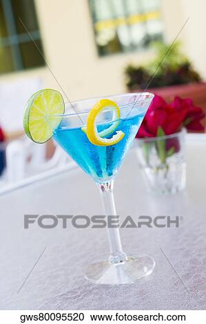 Close-up of a cocktail with a slice of lime on the table View Large Photo Image Stock Image - Close-up of a cocktail with a slice of lime on the table. Fotosearch