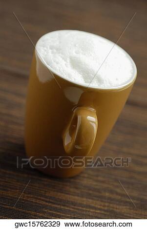 Stock Photo - Close-up of a coffee cup on the table. Fotosearch