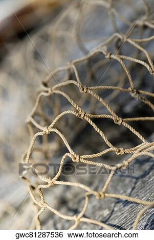 Stock Photograph - Close-up of a commercial fishing net. Fotosearch