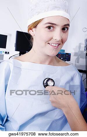 Close-up of a doctor's hand holding a stethoscope and examining a female patient View Large Photo Image Stock Photo - Close-up of a doctor's hand holding a stethoscope and examining a female patient. Fotosearch