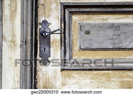Close-up of a door handle on a wooden door View Large Photo Image Stock Image - Close-up of a door handle on a wooden door. Fotosearch