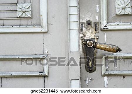 Close-up of a door handle on a wooden door View Large Photo Image Stock Photography - Close-up of a door handle on a wooden door. Fotosearch