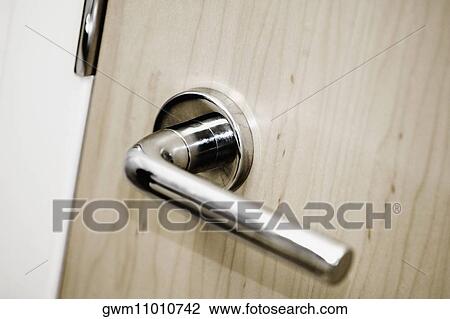 Stock Image - Close-up of a door handle. Fotosearch