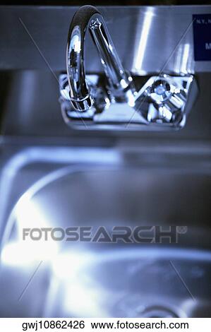 Close-up of a faucet View Large Photo Image Stock Photograph - Close-up of a faucet. Fotosearch