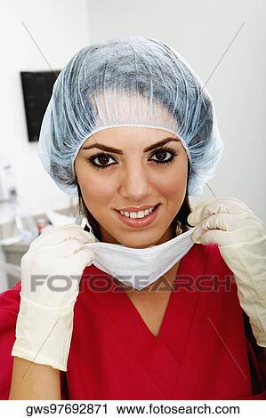 Close-up of a female surgeon smiling View Large Photo Image Stock Image - Close-up of a female surgeon smiling. Fotosearch