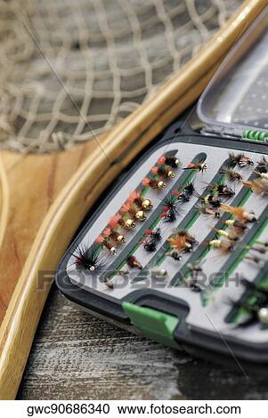 Stock Image - Close-up of a fishing net and fishing lures. Fotosearch