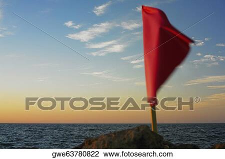 Close-up of a flag fluttering on a rock, Cartagena, Colombia View Large Photo Image Stock Image - Close-up of a flag fluttering on a rock, Cartagena, Colombia. Fotosearch