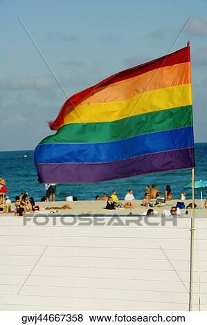Stock Photo - Close-up of a flag fluttering on the beach. Fotosearch