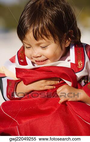 Close-up of a girl in traditional clothing View Large Photo Image Stock Photography - Close-up of a girl in traditional clothing. Fotosearch