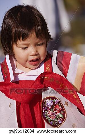 Close-up of a girl looking down View Large Photo Image Picture - Close-up of a girl looking down. Fotosearch
