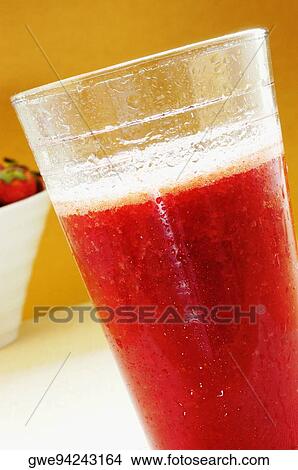 Picture - Close-up of a glass of juice. Fotosearch