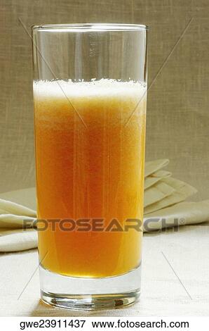 Close-up of a glass of juice View Large Photo Image Stock Photo - Close-up of a glass of juice. Fotosearch