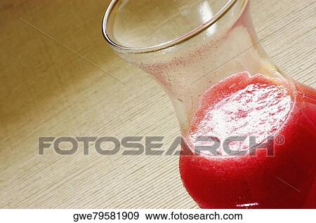 Close-up of a glass of juice View Large Photo Image Stock Photo - Close-up of a glass of juice. Fotosearch