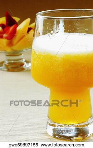 Close-up of a glass of juice View Large Photo Image Stock Photography - Close-up of a glass of juice. Fotosearch