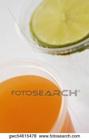 Close-up of a glass of orange juice and a glass of lemonade View Large Photo Image Stock Photo - Close-up of a glass of orange juice and a glass of lemonade. Fotosearch