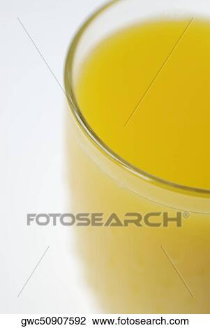 Close-up of a glass of orange juice View Large Photo Image Stock Image - Close-up of a glass of orange juice. Fotosearch