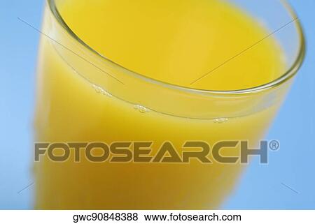 Close-up of a glass of orange juice View Large Photo Image Stock Photo - Close-up of a glass of orange juice. Fotosearch