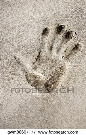 Close-up of a handprint on a wall View Large Photo Image Stock Photo - Close-up of a handprint on a wall. Fotosearch