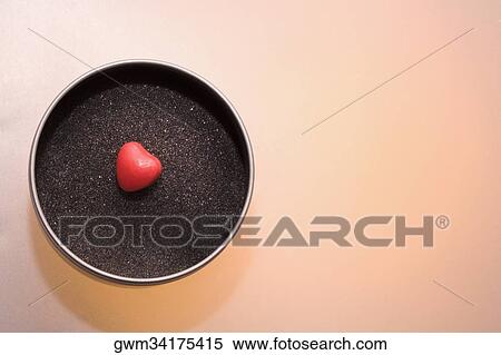 Close-up of a heart shaped candy in a bowl View Large Photo Image Stock Photography - Close-up of a heart shaped candy in a bowl. Fotosearch