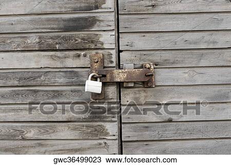 Close-up of a locked wooden door View Large Photo Image Stock Image - Close-up of a locked wooden door. Fotosearch