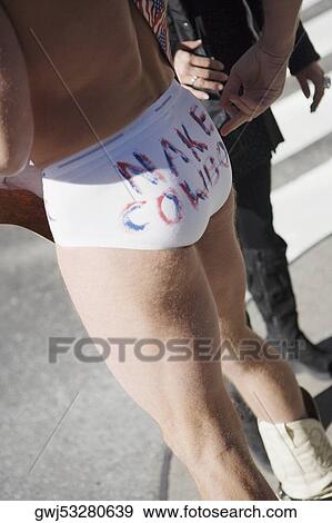 Close-up of a man and a woman standing View Large Photo Image Stock Photo - Close-up of a man and a woman standing. Fotosearch