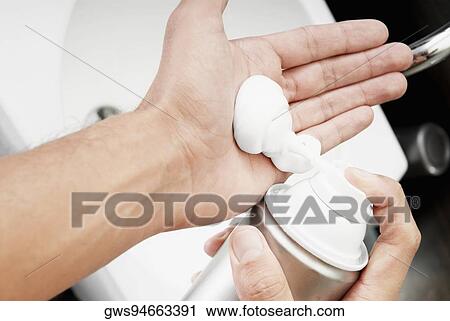 Close-up of a man applying shaving cream on his hand View Large Photo Image Stock Image - Close-up of a man applying shaving cream on his hand. Fotosearch