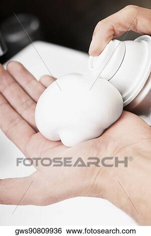 Close-up of a man applying shaving cream on his hand View Large Photo Image Stock Photograph - Close-up of a man applying shaving cream on his hand. Fotosearch
