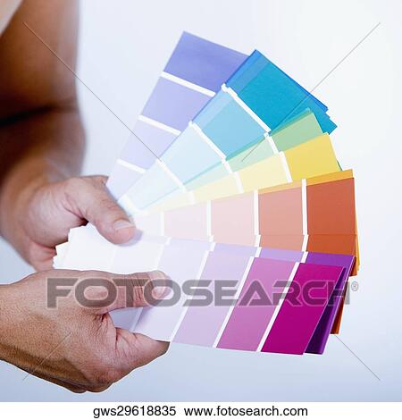 Close-up of a man's hands holding color swatches View Large Photo Image Stock Photography - Close-up of a man's hands holding color swatches. Fotosearch