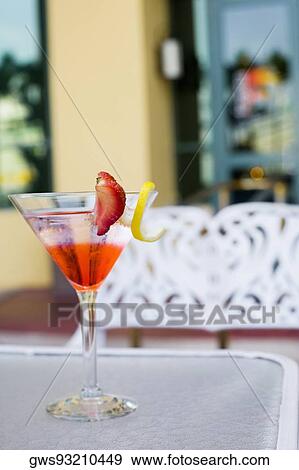 Close-up of a martini glass on the table View Large Photo Image Stock Photo - Close-up of a martini glass on the table. Fotosearch