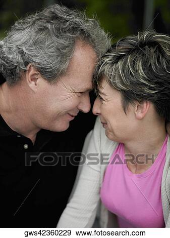 Close-up of a mature couple face to face and smiling View Large Photo Image Stock Photo - Close-up of a mature couple face to face and smiling. Fotosearch