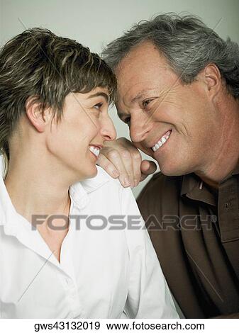 Close-up of a mature couple smiling View Large Photo Image Stock Photo - Close-up of a mature couple smiling. Fotosearch