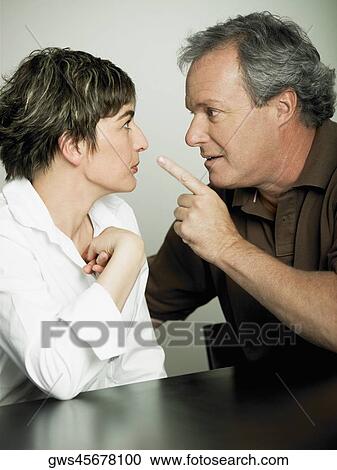 Close-up of a mature man arguing with his wife View Large Photo Image Stock Image - Close-up of a mature man arguing with his wife. Fotosearch