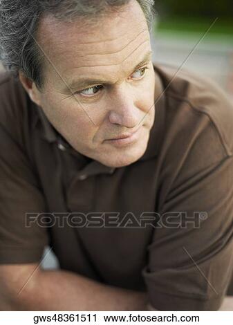 Close-up of a mature man looking sideways View Large Photo Image Stock Image - Close-up of a mature man looking sideways. Fotosearch