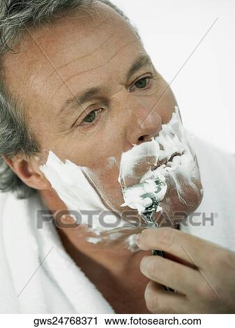 Close-up of a mature man shaving View Large Photo Image Stock Image - Close-up of a mature man shaving. Fotosearch