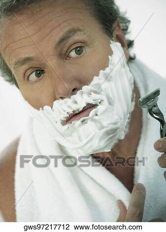 Close-up of a mature man shaving View Large Photo Image Stock Image - Close-up of a mature man shaving. Fotosearch