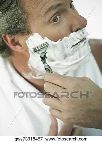 Close-up of a mature man shaving View Large Photo Image Stock Photo - Close-up of a mature man shaving. Fotosearch