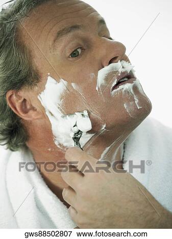 Close-up of a mature man shaving View Large Photo Image Stock Photo - Close-up of a mature man shaving. Fotosearch