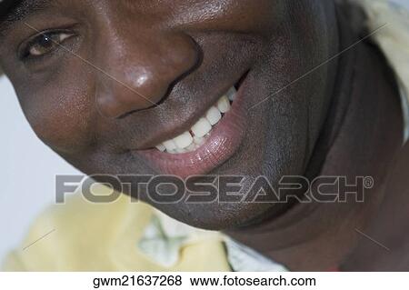 Close-up of a mature man smiling View Large Photo Image Stock Photo - Close-up of a mature man smiling. Fotosearch