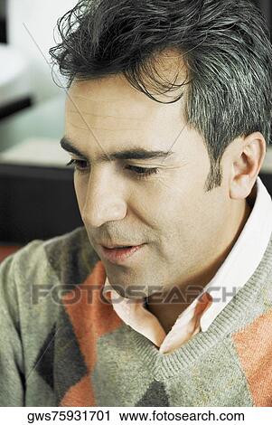 Close-up of a mature man smirking View Large Photo Image Stock Image - Close-up of a mature man smirking. Fotosearch